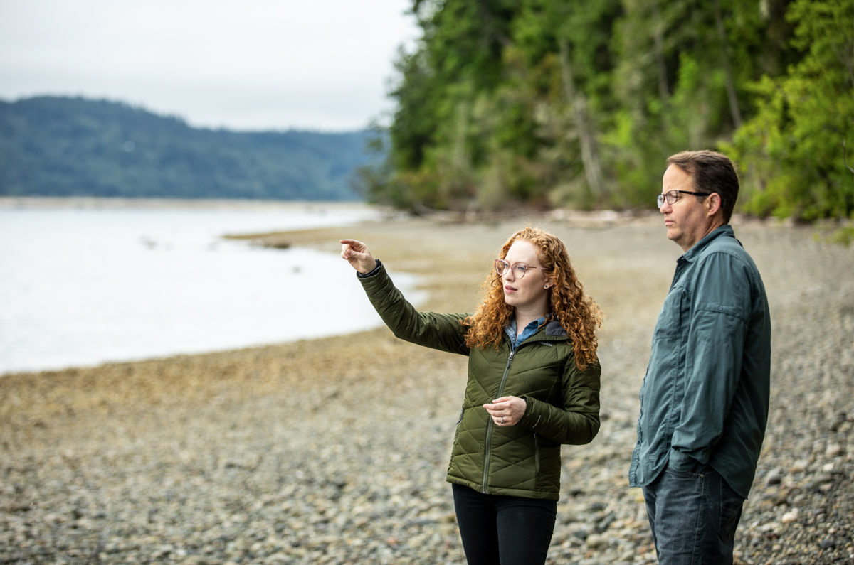 Ben standing with a shellfish farm owner