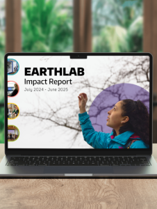 Mock up of the cover of the FY 2025 Impact Report on a computer screen with greenery in the background.